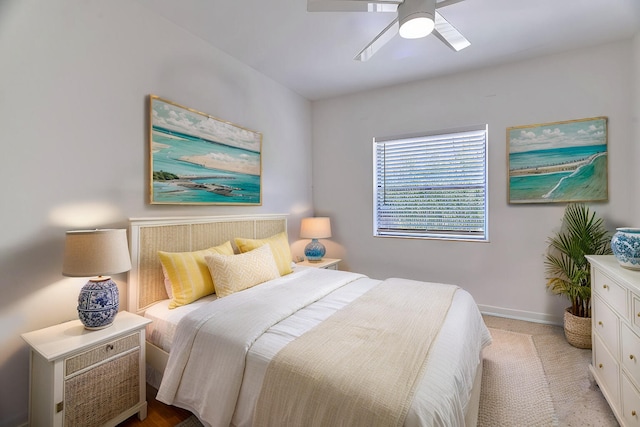 bedroom featuring light colored carpet and ceiling fan