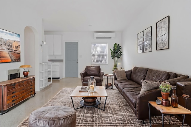 living room featuring a wall unit AC