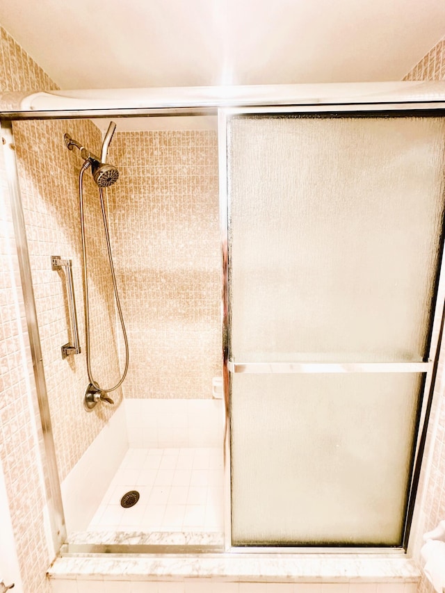 bathroom with a stall shower