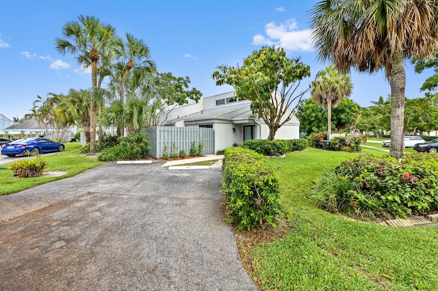 view of property featuring a front yard