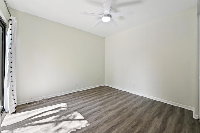 unfurnished room with ceiling fan and dark hardwood / wood-style floors