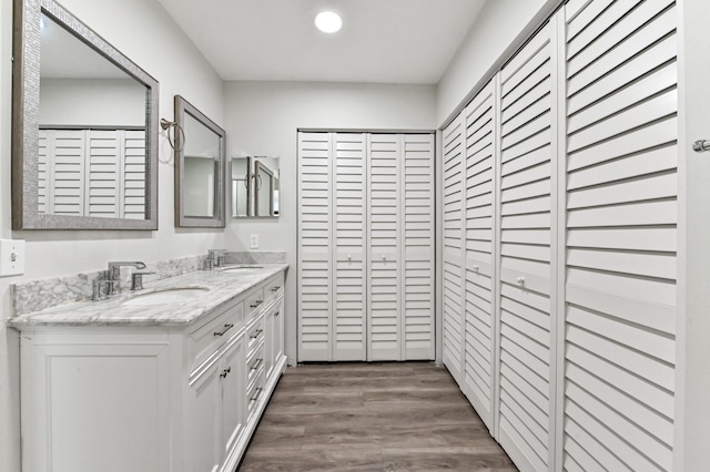 bathroom featuring vanity and hardwood / wood-style flooring