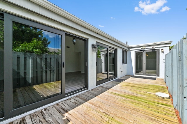 wooden deck featuring french doors