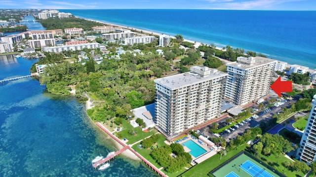 birds eye view of property with a water view