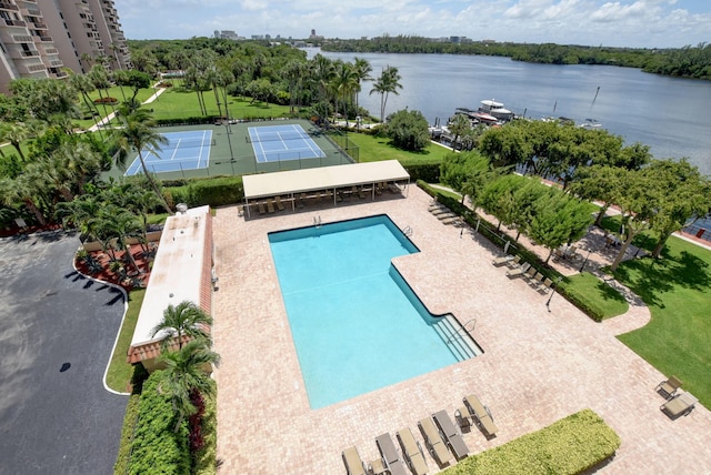 view of swimming pool with a water view