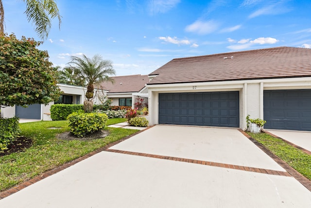 ranch-style home with a garage