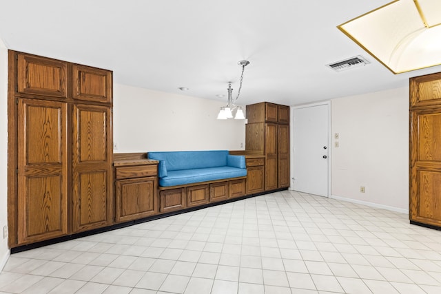 kitchen featuring decorative light fixtures and an inviting chandelier