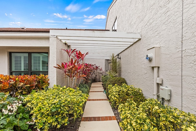 view of property exterior featuring a pergola