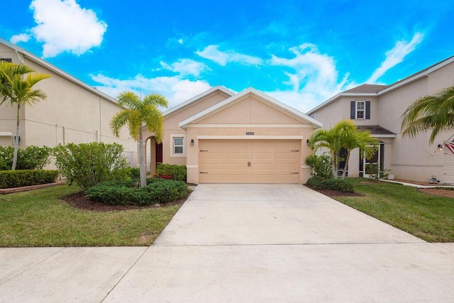 view of front of home with a garage and a front yard