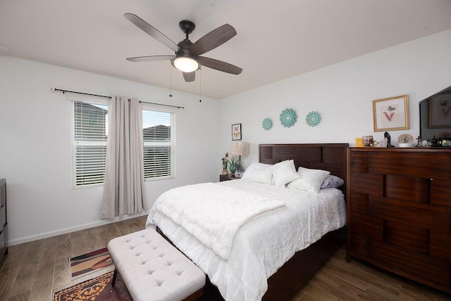 bedroom featuring ceiling fan and dark hardwood / wood-style floors