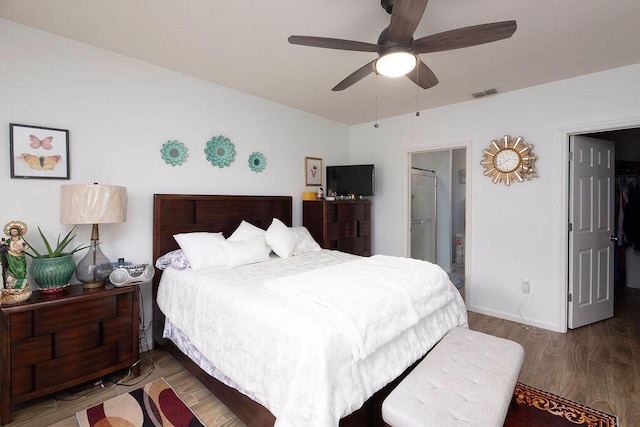 bedroom with dark wood-type flooring and ceiling fan