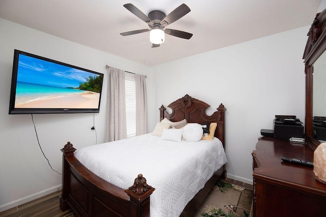 bedroom featuring ceiling fan and dark hardwood / wood-style flooring