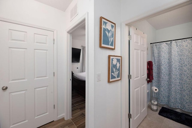 bathroom with a shower with shower curtain