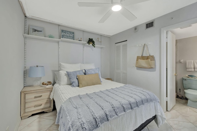 tiled bedroom featuring a closet and ceiling fan