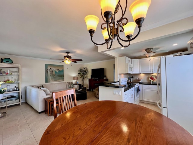 tiled dining room with crown molding and ceiling fan with notable chandelier