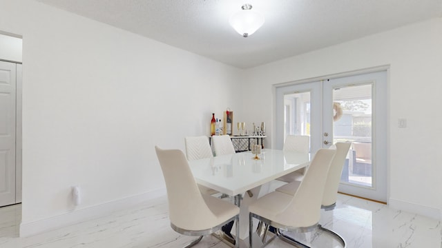 dining space featuring french doors