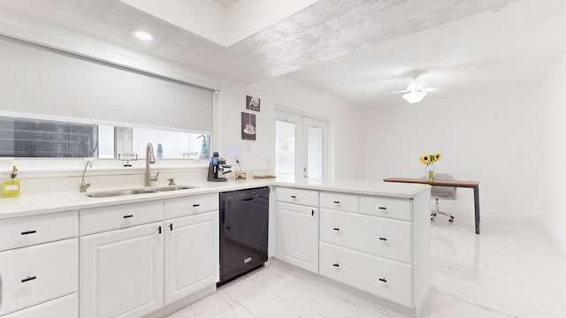 kitchen featuring ceiling fan, kitchen peninsula, sink, black dishwasher, and white cabinets