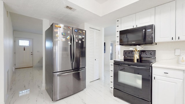 kitchen with white cabinets and black appliances