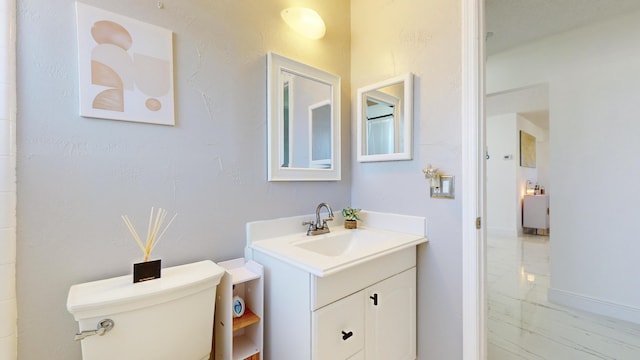 bathroom with toilet and vanity