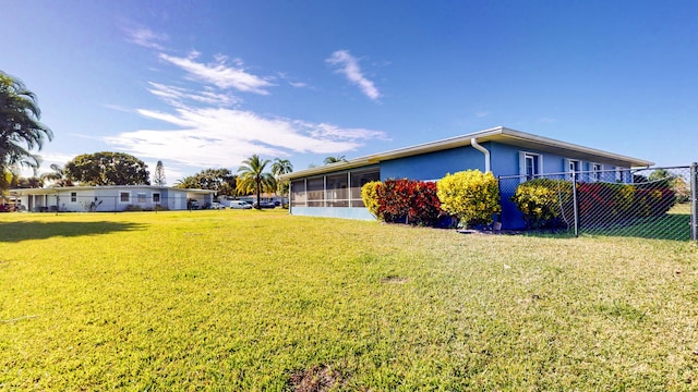 view of side of property featuring a lawn