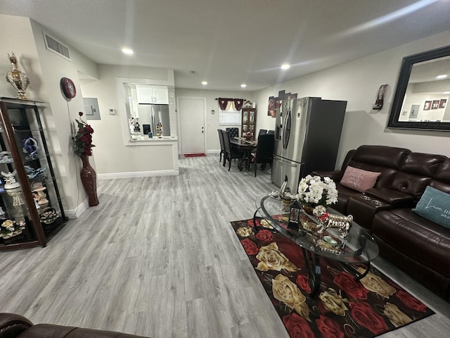 living room with light hardwood / wood-style floors