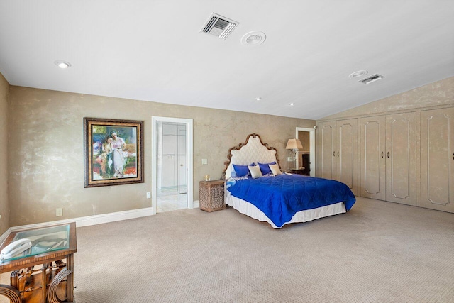 bedroom with lofted ceiling and light colored carpet