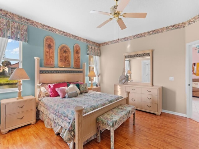 bedroom featuring ceiling fan and light hardwood / wood-style flooring