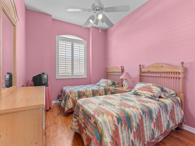 bedroom featuring ceiling fan and light hardwood / wood-style floors