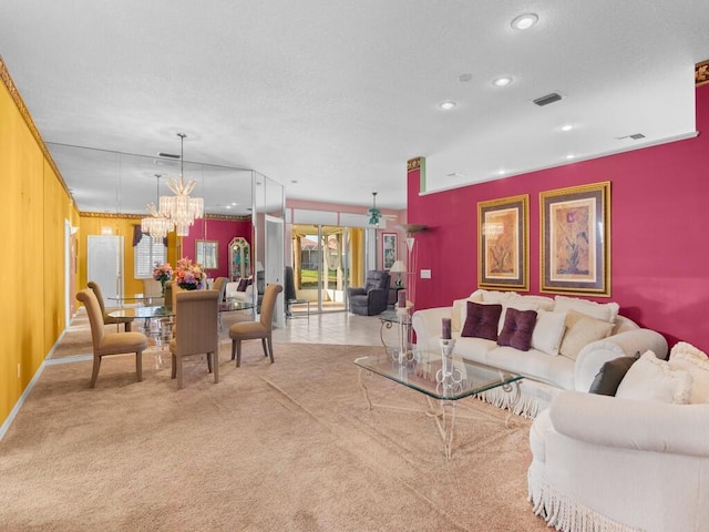 living room with ornamental molding, wooden walls, light carpet, and an inviting chandelier