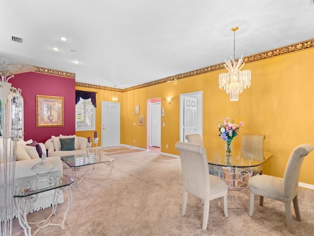 dining space featuring an inviting chandelier, carpet flooring, and crown molding