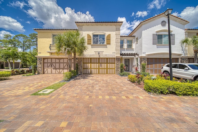 mediterranean / spanish house with a garage