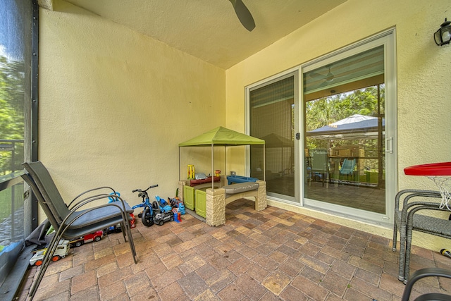 view of patio / terrace featuring ceiling fan