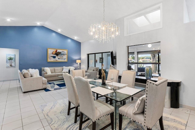 dining area featuring a notable chandelier, high vaulted ceiling, and light tile patterned floors