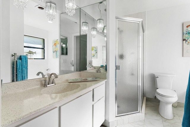 bathroom featuring vanity, an enclosed shower, and toilet