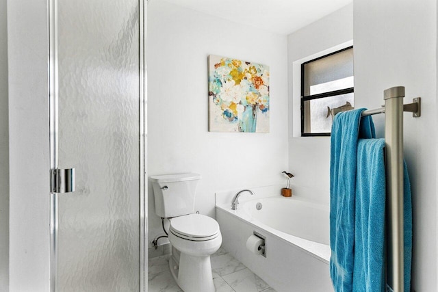 bathroom featuring shower with separate bathtub and toilet