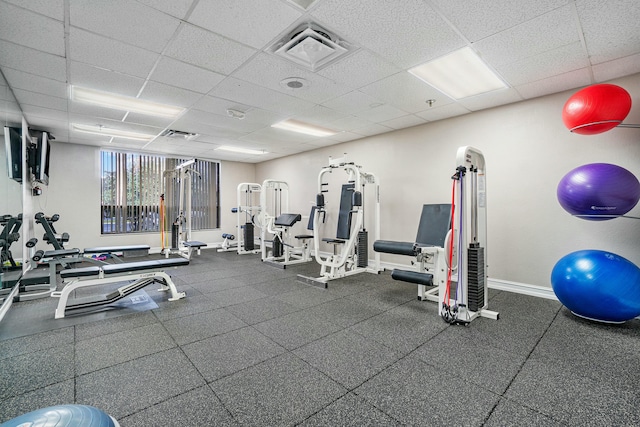 workout area with a drop ceiling