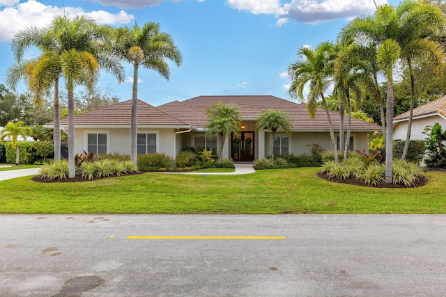 single story home with a front yard