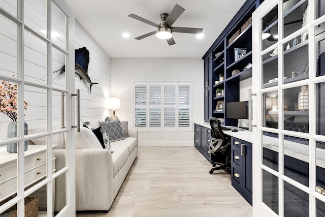 office area featuring light hardwood / wood-style floors and ceiling fan