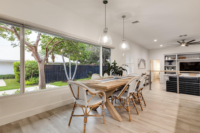 dining room with ceiling fan and light wood-type flooring