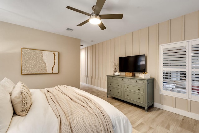 bedroom featuring ceiling fan and light hardwood / wood-style floors