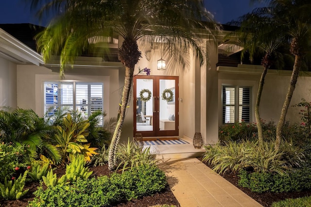 property entrance featuring french doors