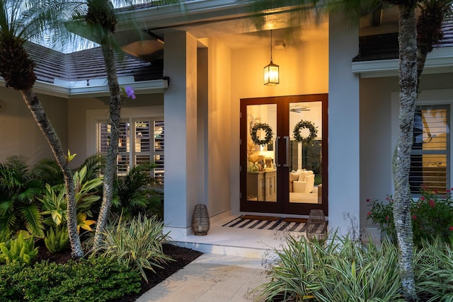 view of exterior entry featuring french doors