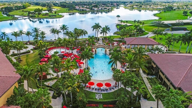 birds eye view of property with a water view