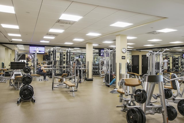 exercise room featuring a drop ceiling