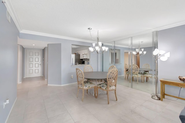 tiled dining room featuring an inviting chandelier and ornamental molding