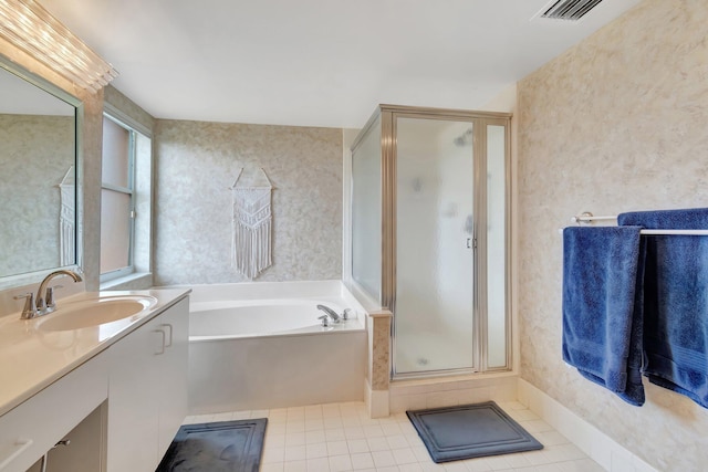 bathroom with tile patterned flooring, shower with separate bathtub, and vanity