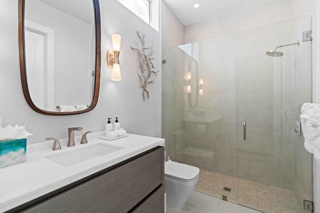 bathroom featuring toilet, tile patterned flooring, a shower with door, and vanity