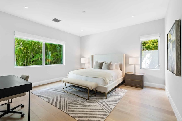 bedroom with light hardwood / wood-style flooring