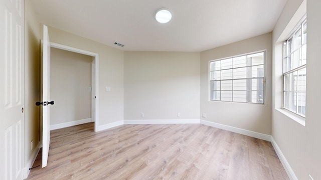 unfurnished room featuring light hardwood / wood-style flooring