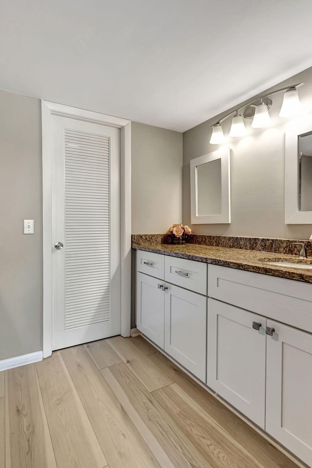 bathroom featuring vanity and hardwood / wood-style floors